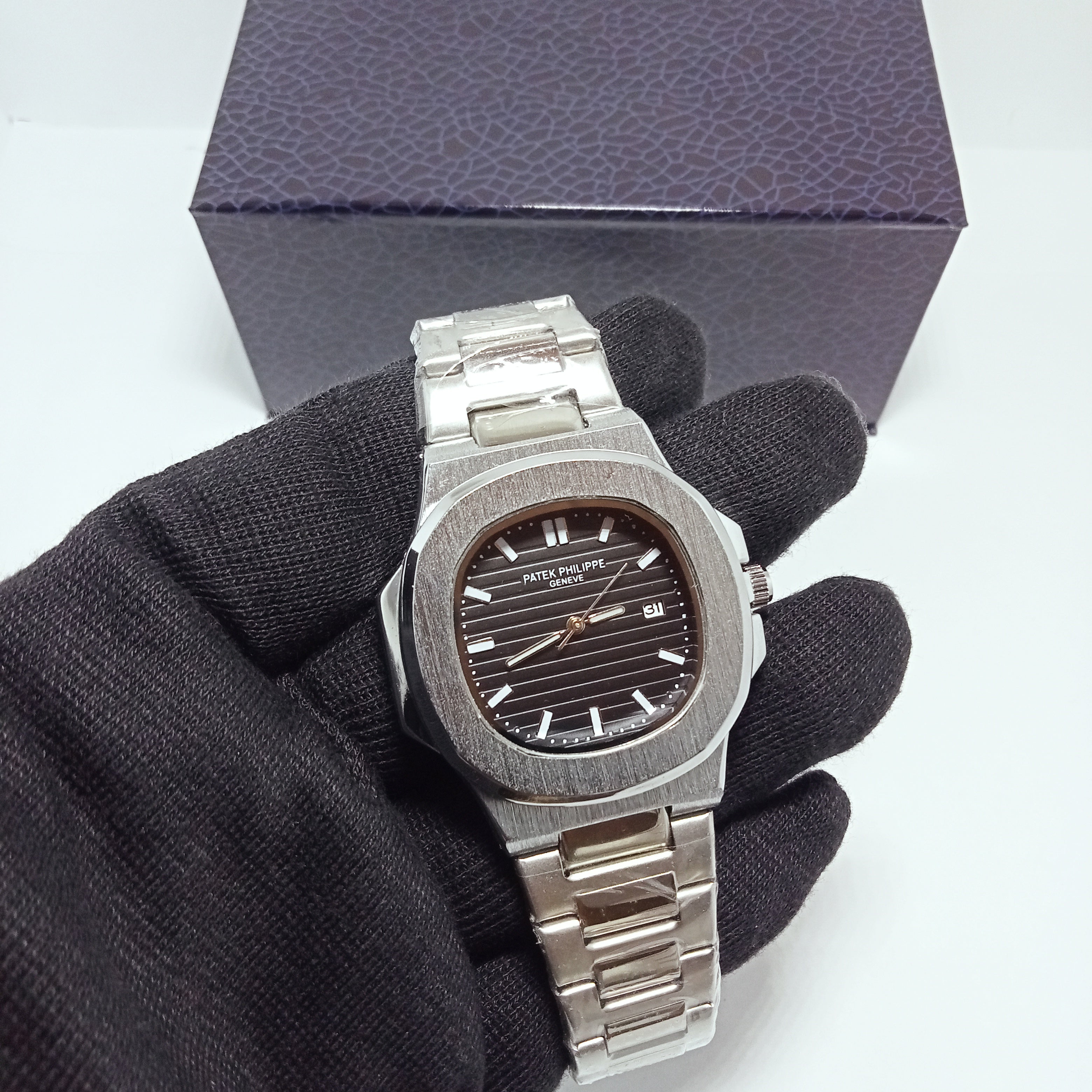 Patek Philippe Elegant Silver Watch – Black Dial.